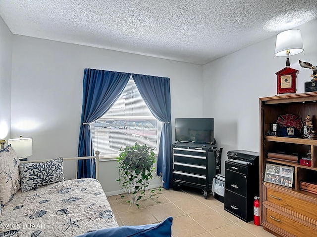 420 Banana Cay Dr Unit A, South Daytona, FL 32119 - bedroom with a textured ceiling and light tile patterned floors