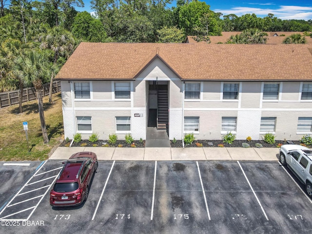 420 Banana Cay Dr Unit A, South Daytona, FL 32119 - view of building exterior featuring fence and uncovered parking