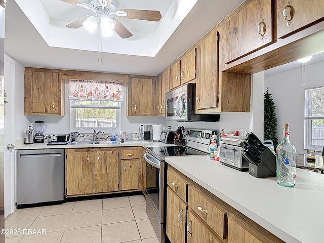 420 Banana Cay Dr Unit A, South Daytona, FL 32119 - kitchen featuring a ceiling fan, light tile patterned flooring, light countertops, a sink, and stainless steel appliances