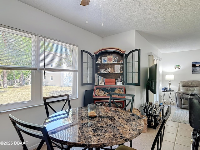 420 Banana Cay Dr Unit A, South Daytona, FL 32119 - dining space with a textured ceiling and ceiling fan