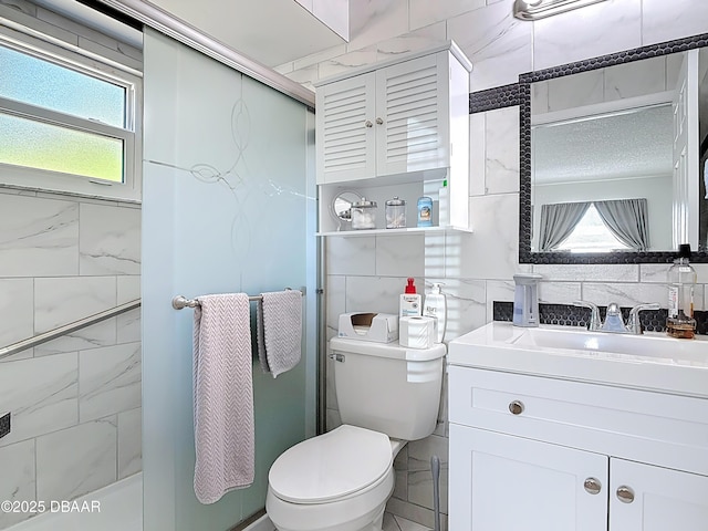 420 Banana Cay Dr Unit A, South Daytona, FL 32119 - full bathroom featuring an enclosed shower, tile walls, plenty of natural light, and toilet