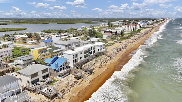 bird's eye view with a water view and a view of the beach