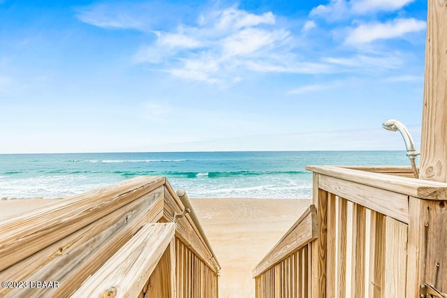 view of community featuring a water view and a view of the beach