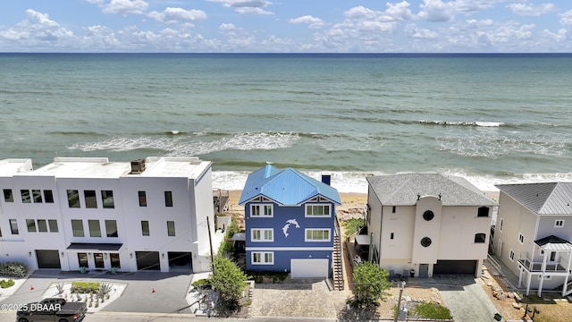 bird's eye view featuring a water view and a view of the beach