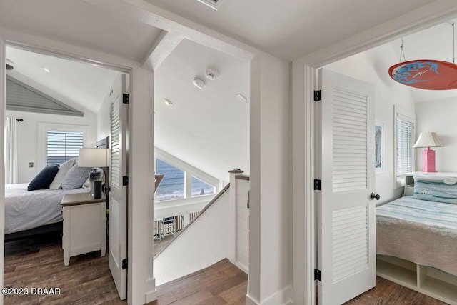 bedroom featuring lofted ceiling and wood finished floors