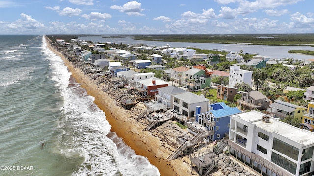bird's eye view with a water view and a view of the beach