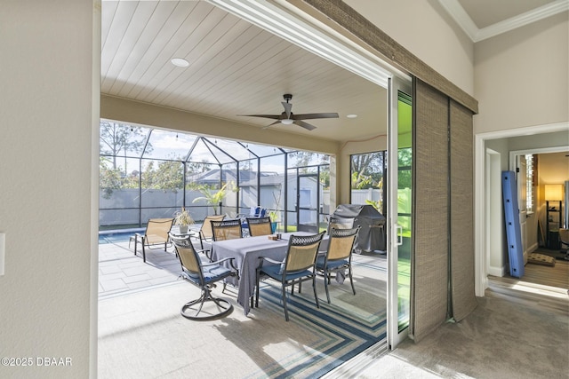 view of patio with a fenced in pool, ceiling fan, grilling area, and glass enclosure