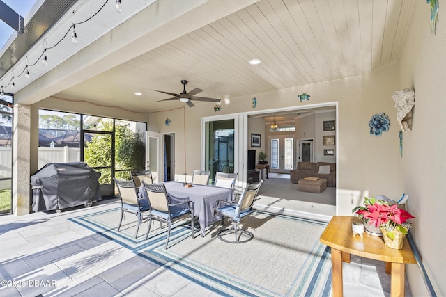 view of patio featuring a grill, ceiling fan, and french doors