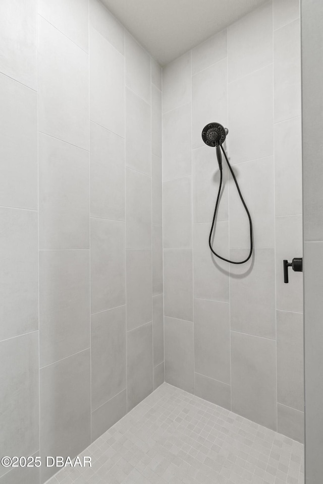 bathroom with tiled shower