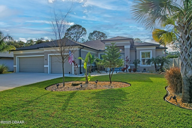 view of front of house with a garage and a front yard