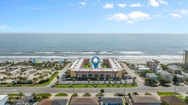 drone / aerial view with a view of the beach and a water view