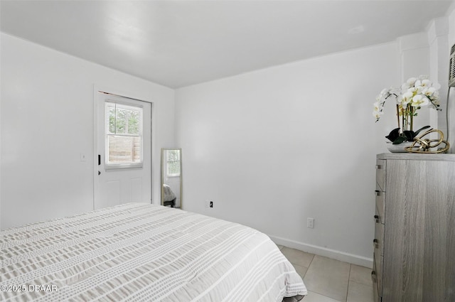 bedroom featuring baseboards and light tile patterned flooring