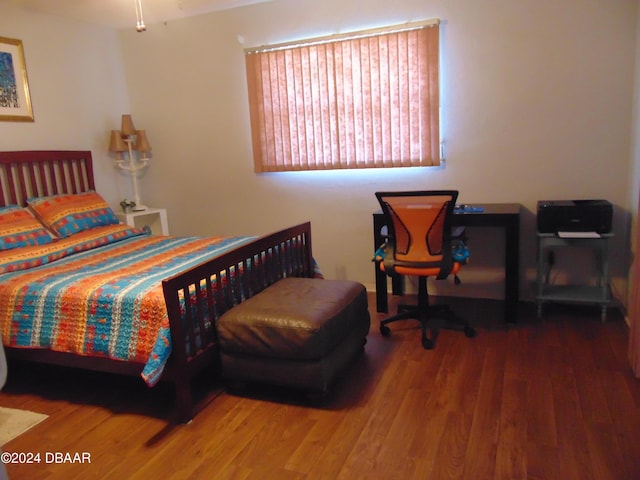 bedroom featuring hardwood / wood-style floors