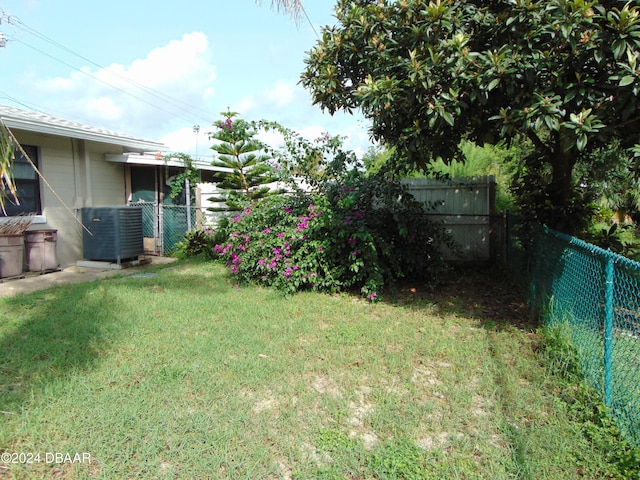 view of yard with central AC unit