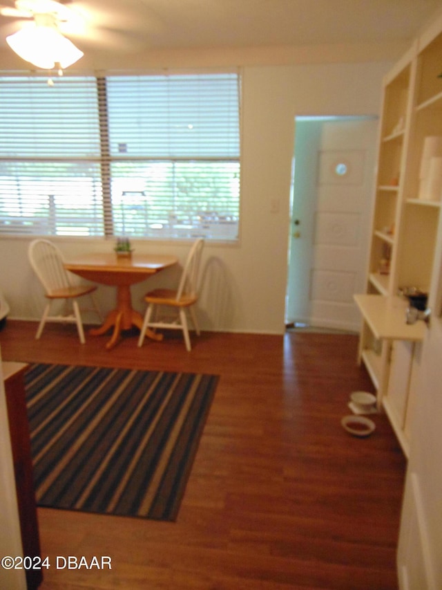 dining area with dark hardwood / wood-style flooring