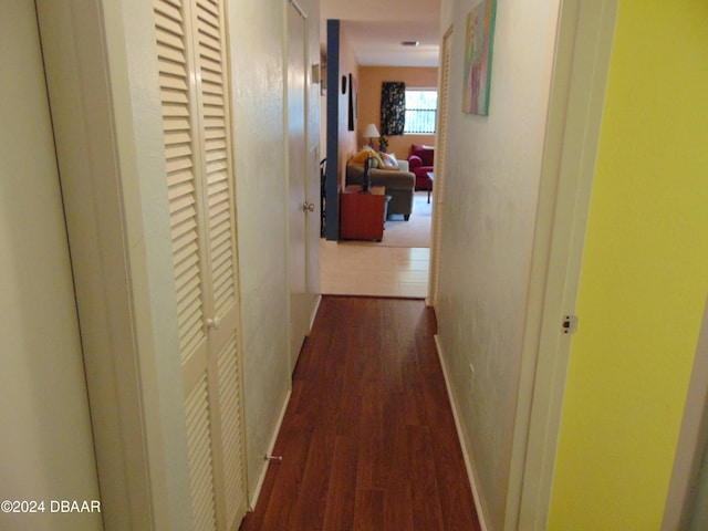 hallway featuring dark hardwood / wood-style flooring