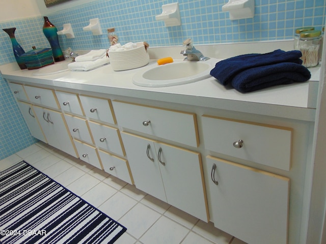 bathroom featuring tile patterned flooring, decorative backsplash, vanity, and tile walls