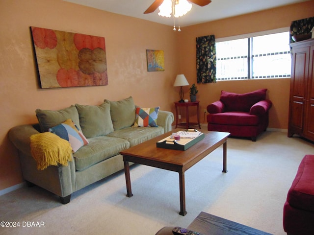 living room with ceiling fan and light colored carpet