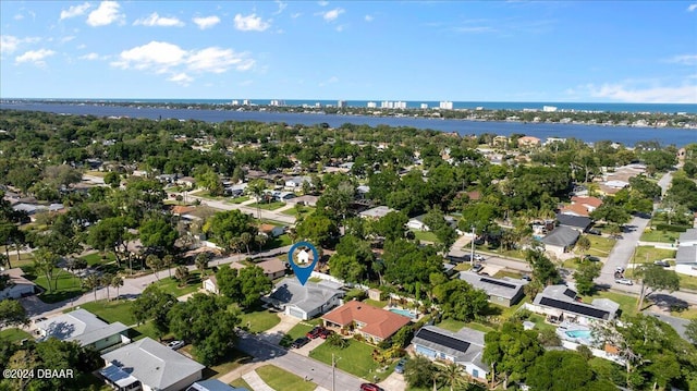 birds eye view of property with a water view