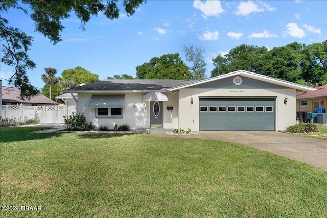 ranch-style house with a garage and a front yard