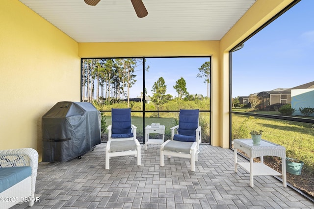 sunroom / solarium with ceiling fan and plenty of natural light