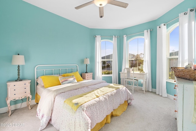 bedroom with ceiling fan and light colored carpet