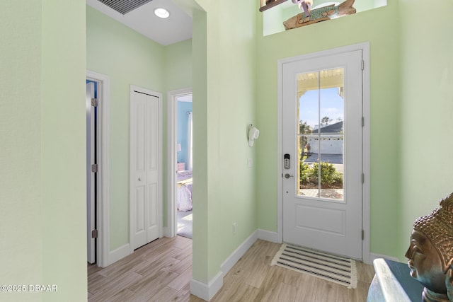 doorway with light hardwood / wood-style flooring