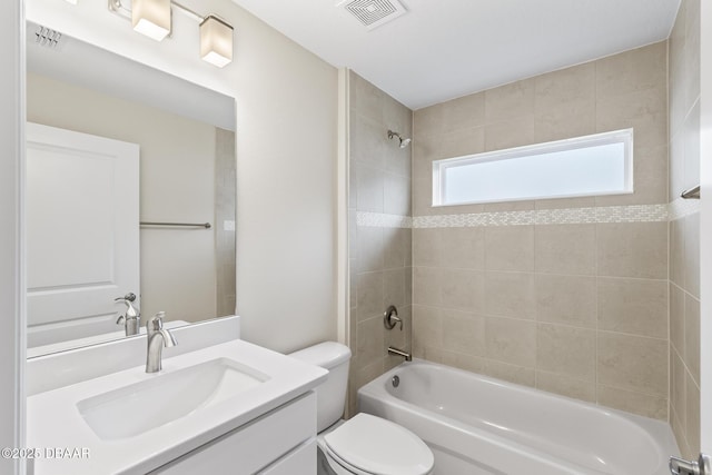 full bathroom featuring visible vents, toilet, shower / bath combination, and vanity