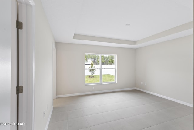 unfurnished room with baseboards