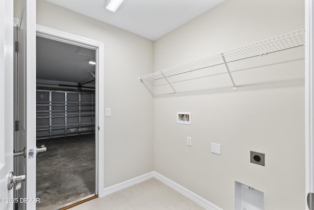 laundry room featuring baseboards, washer hookup, laundry area, a garage, and electric dryer hookup