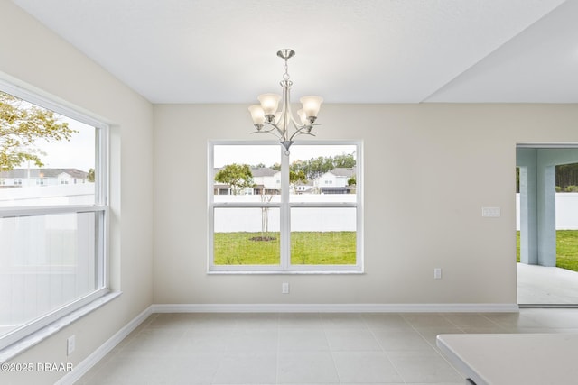 unfurnished dining area with light tile patterned flooring, baseboards, and a chandelier