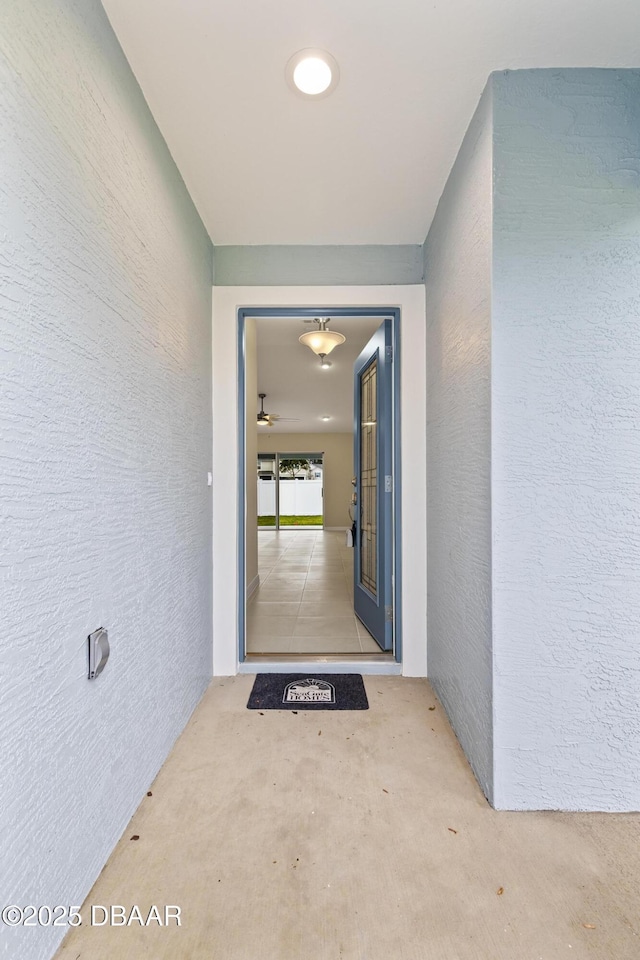 entrance to property with stucco siding