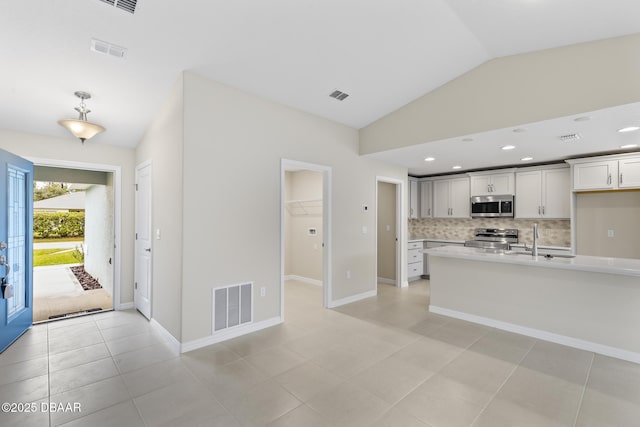 kitchen with light countertops, visible vents, and appliances with stainless steel finishes