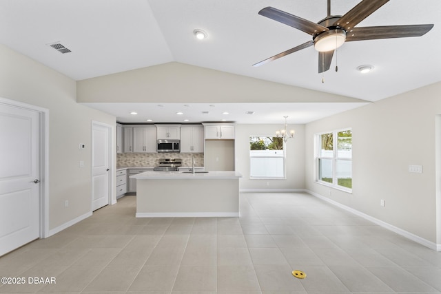 kitchen featuring visible vents, a sink, light countertops, appliances with stainless steel finishes, and tasteful backsplash