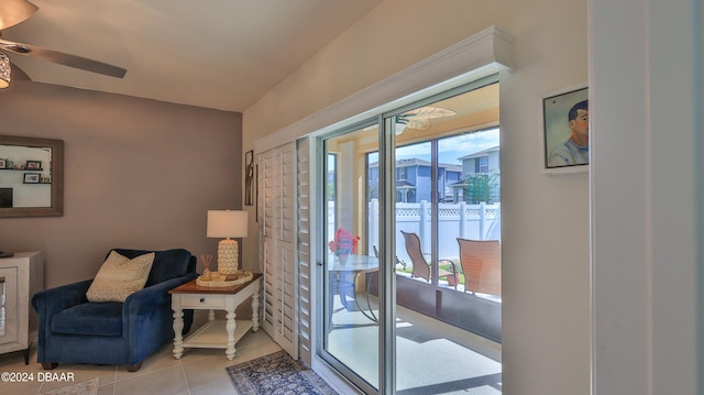 entryway featuring ceiling fan, a healthy amount of sunlight, and light tile patterned floors