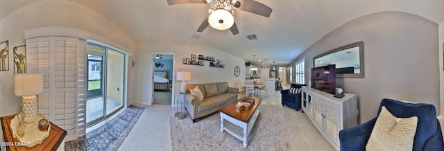 living room with ceiling fan and vaulted ceiling