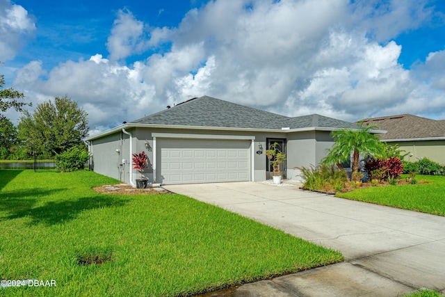 single story home with a garage and a front yard