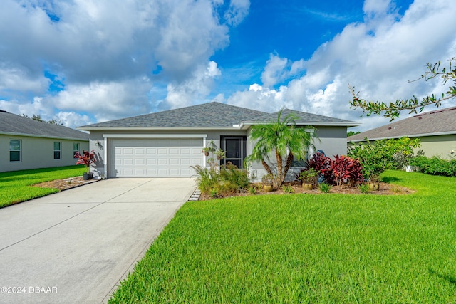 ranch-style house with a garage and a front yard