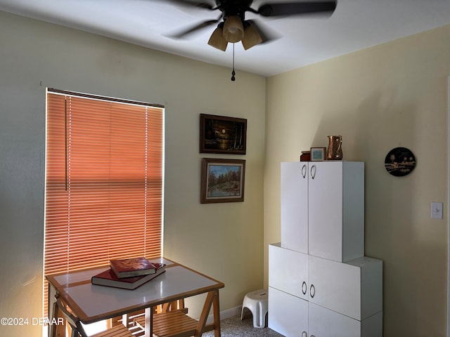 dining area featuring ceiling fan and carpet floors