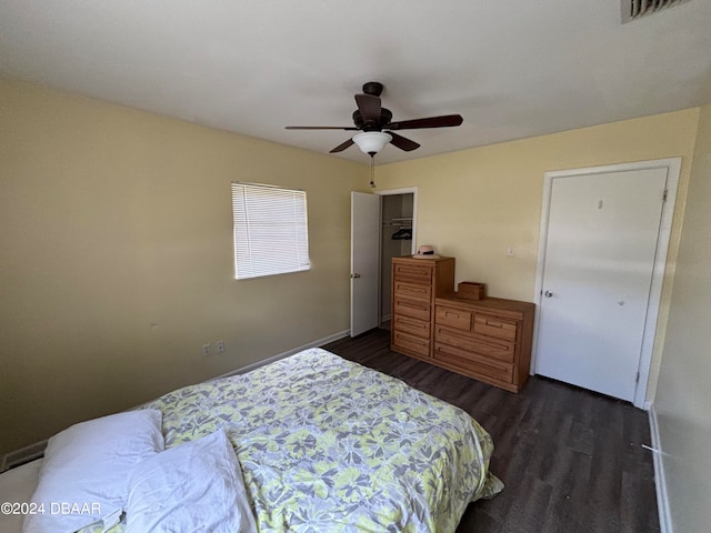 bedroom featuring ceiling fan and dark hardwood / wood-style floors