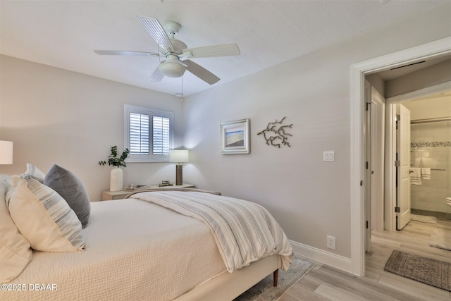 bedroom featuring connected bathroom and ceiling fan