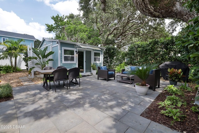 view of patio / terrace featuring an outdoor structure and outdoor lounge area