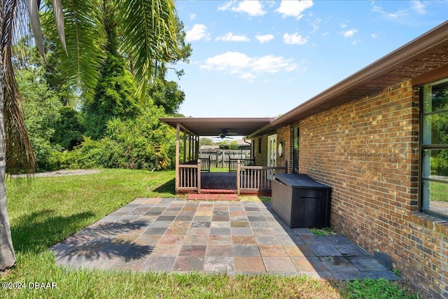 view of patio featuring ceiling fan