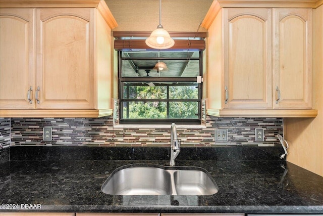 kitchen featuring light brown cabinets and sink