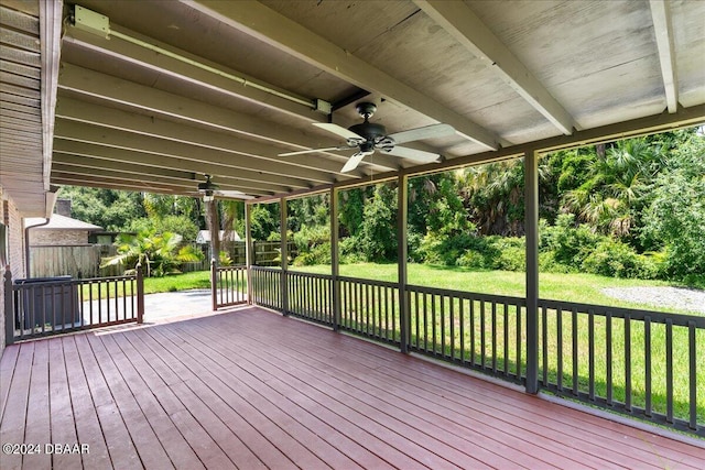 wooden deck with ceiling fan and a yard