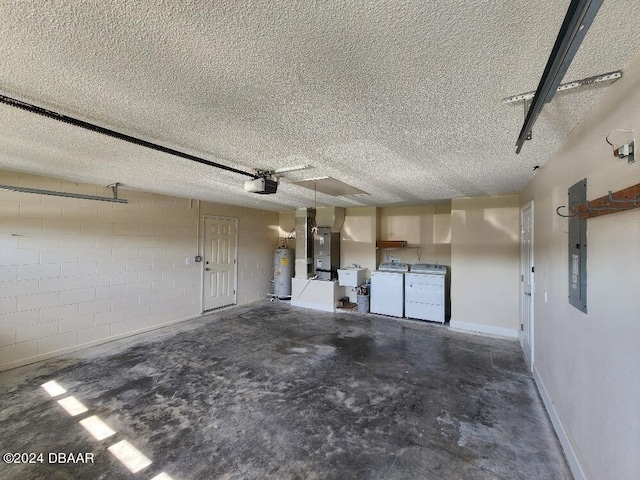 garage featuring electric panel, heating unit, electric water heater, a garage door opener, and washing machine and clothes dryer