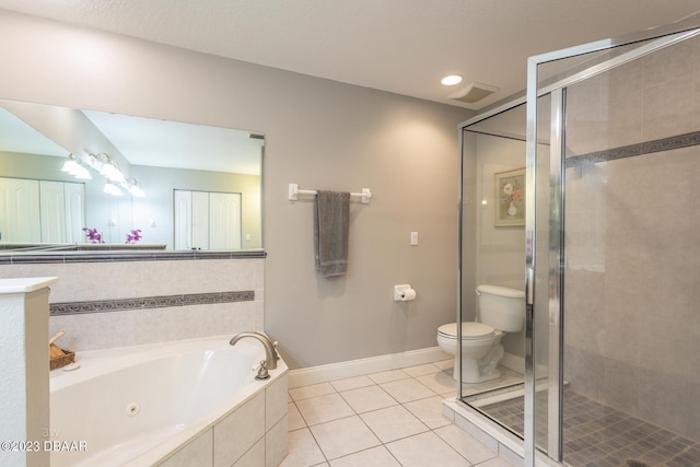 10 Foxhunter Flt, Ormond Beach, FL 32174 - bathroom featuring a tub with jets, tile patterned flooring, toilet, and a shower stall