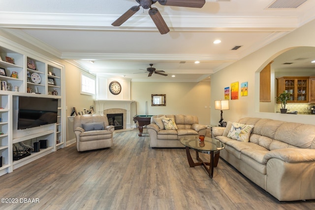 10 Foxhunter Flt, Ormond Beach, FL 32174 - living area featuring a tiled fireplace, wood finished floors, a ceiling fan, and visible vents