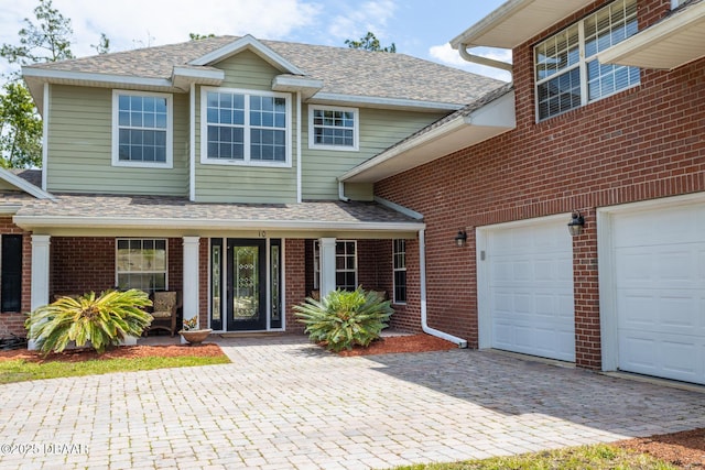 10 Foxhunter Flt, Ormond Beach, FL 32174 - view of front of property featuring brick siding and roof with shingles