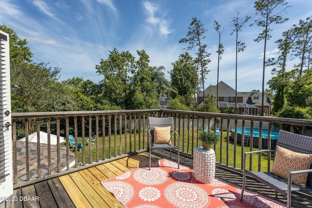 10 Foxhunter Flt, Ormond Beach, FL 32174 - wooden terrace with a lawn